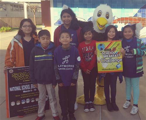 students inviting others for school breakfast 